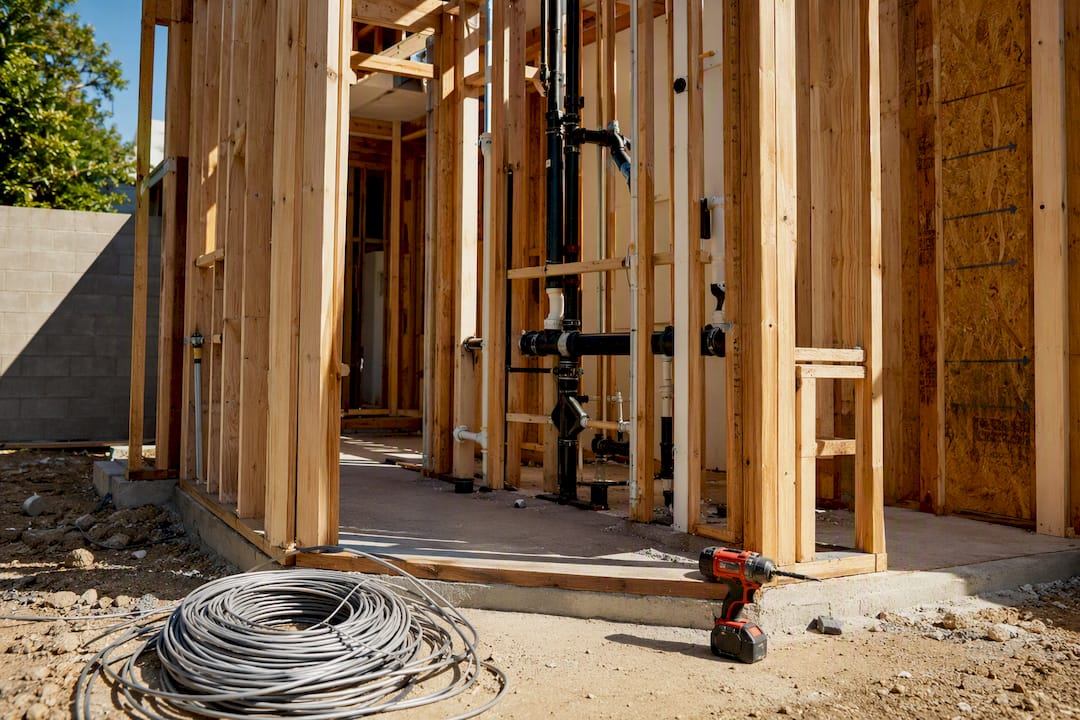 Framing and plumbing in bathroom addition construction