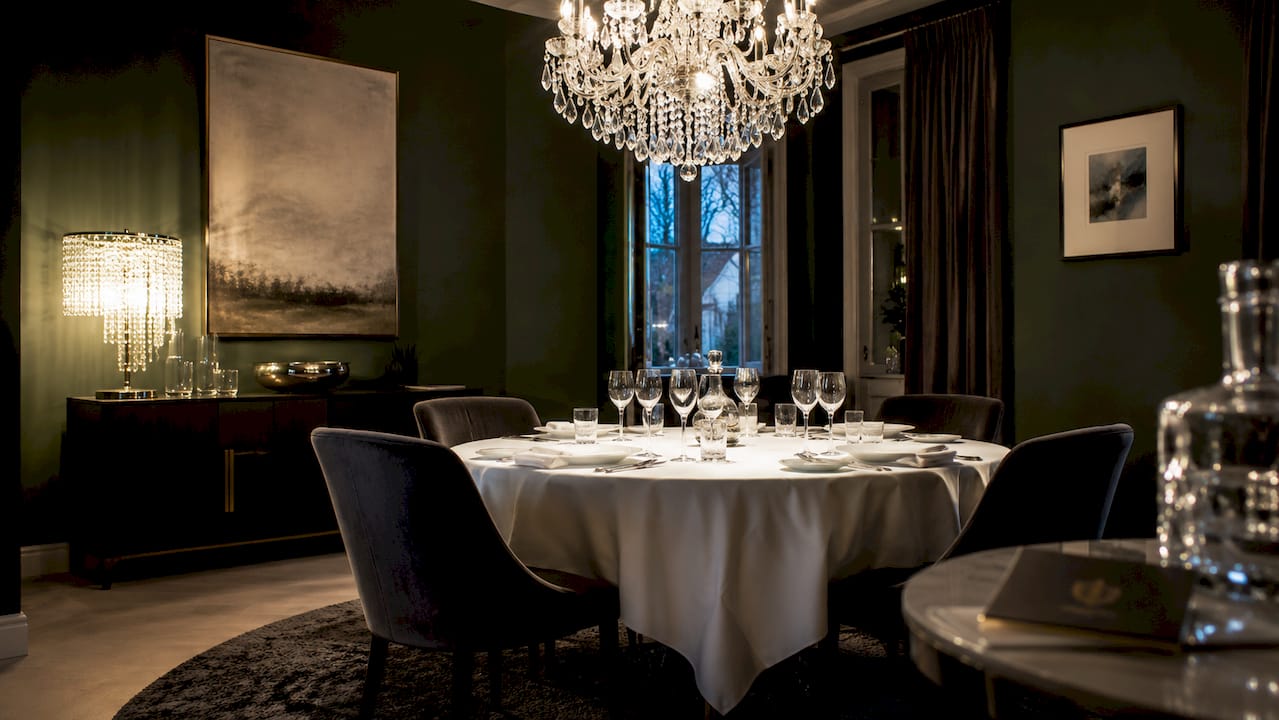 Overhead view of dining room with crystal lighting fixtures