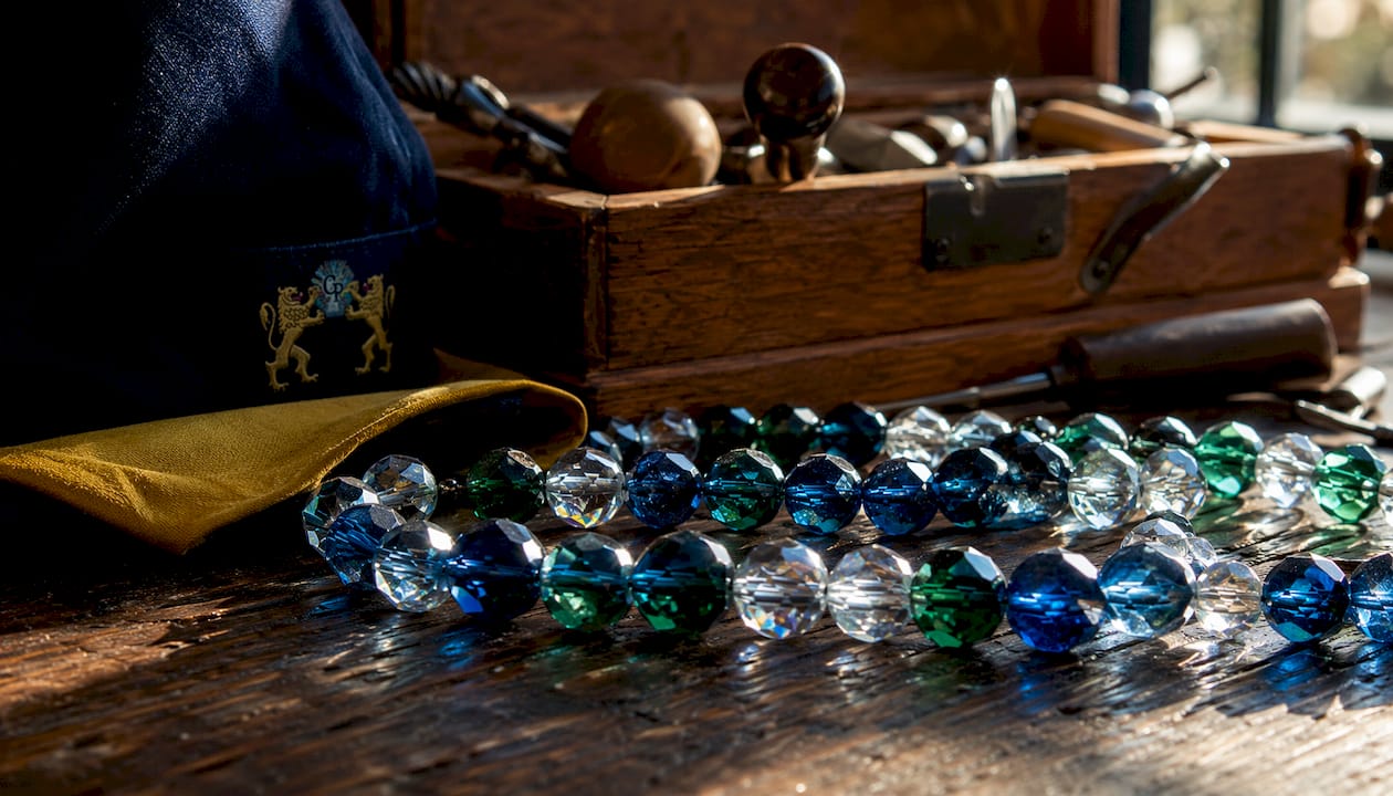 Close-up of sparkling faceted crystal beads with tools