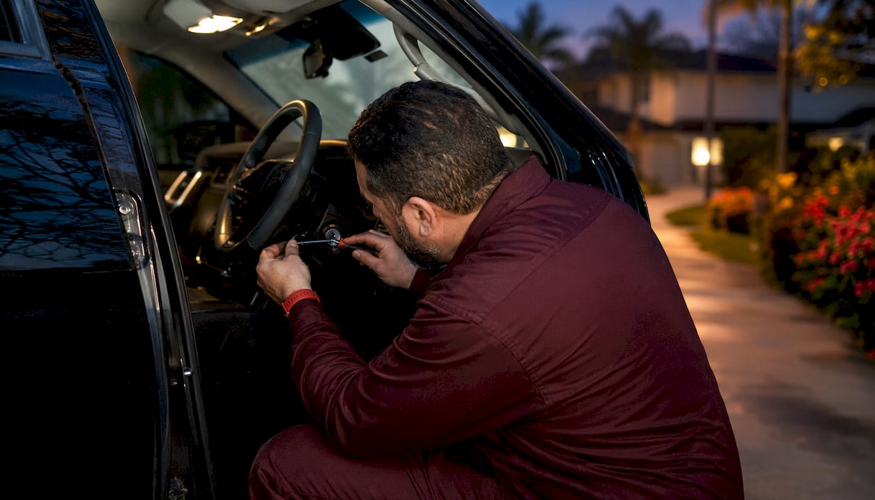 Locksmith extracting broken key from car ignition