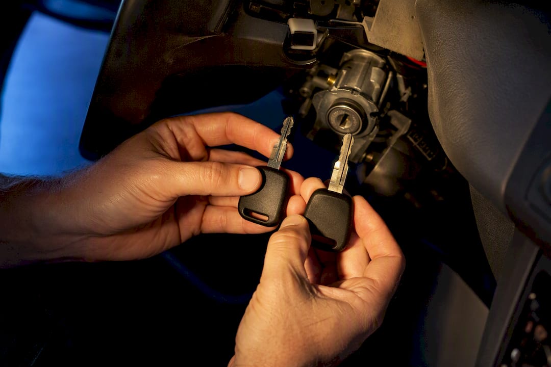 Transponder keys beside cropped ignition barrel