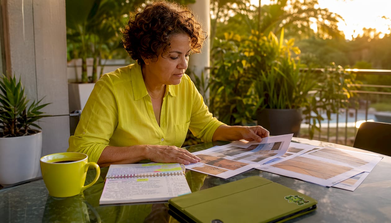 Woman reviewing PVC deck budget papers