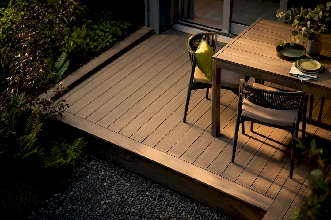 Compact deck dining area in a narrow backyard