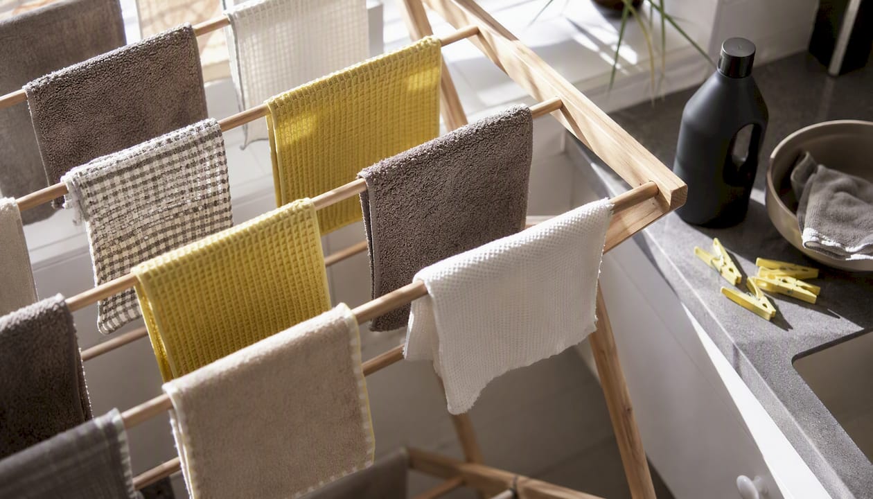 Reusable cleaning cloths hanging to dry in laundry