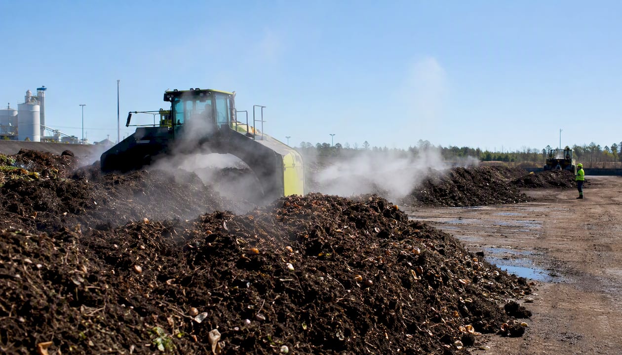 Industrial composting with steaming compost piles