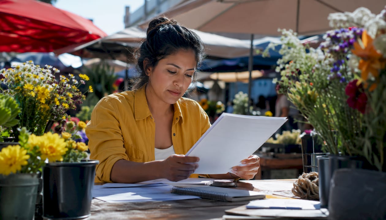 Small business owner reviewing SBA microloan paperwork