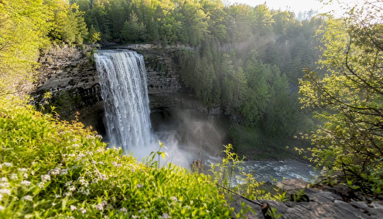 Tew Falls waterfall with mist from lookout