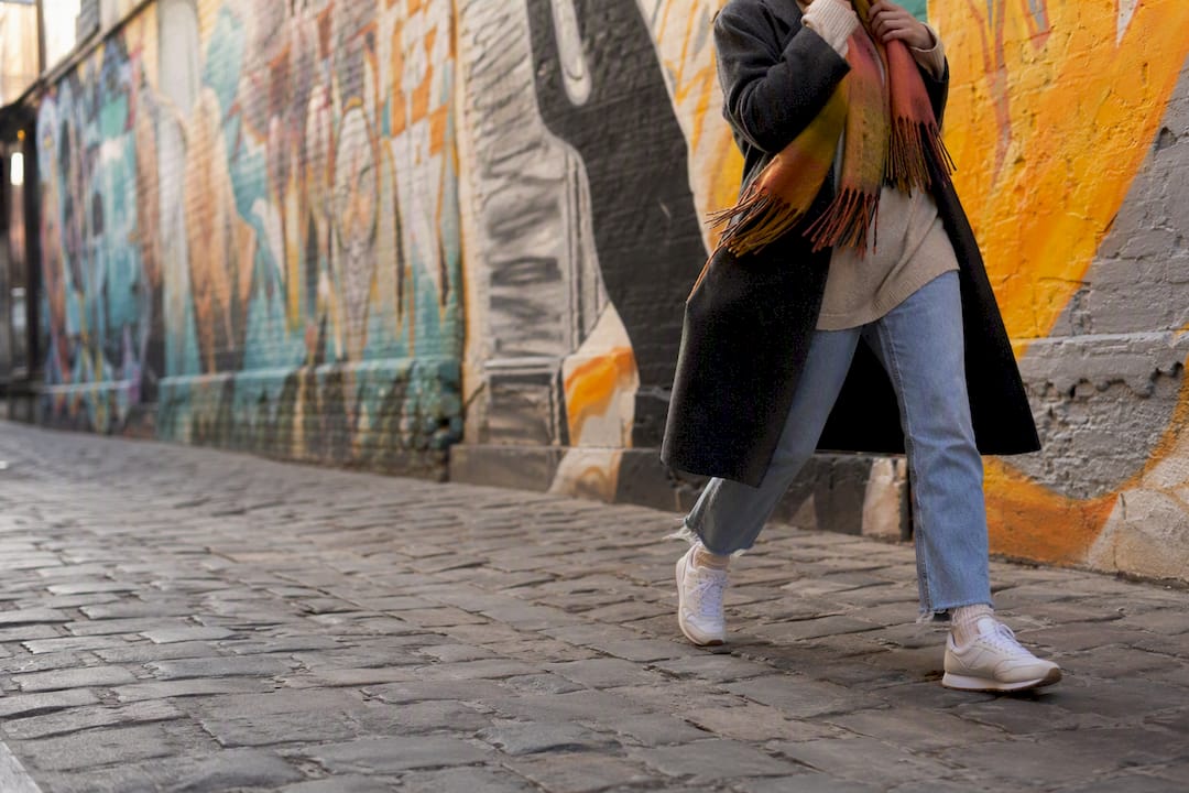 Colorful Graffiti Alley murals with a pedestrian