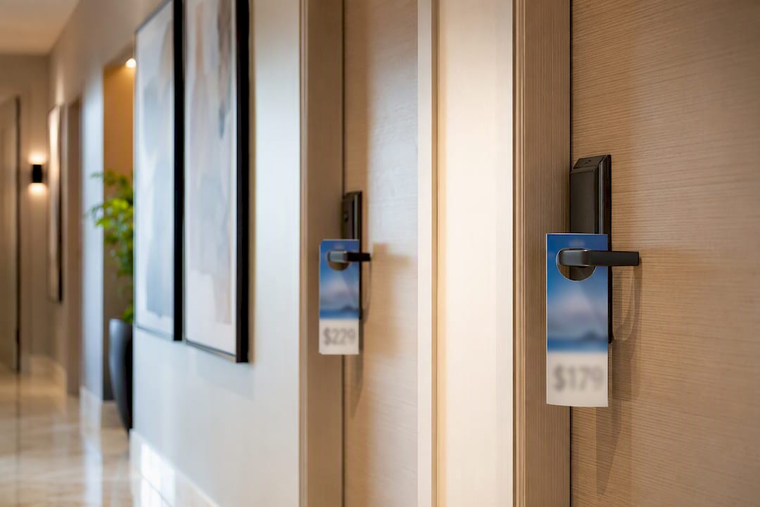 Hotel room doors with weekend and weekday price tags