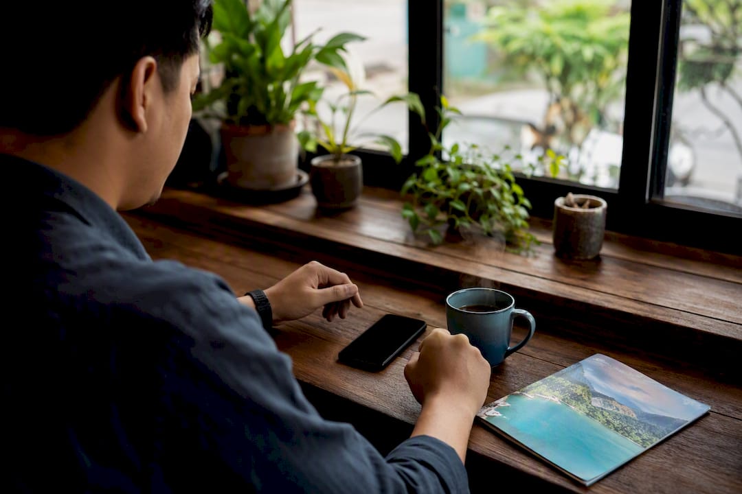 Traveler preparing to book hotel safely with phone off