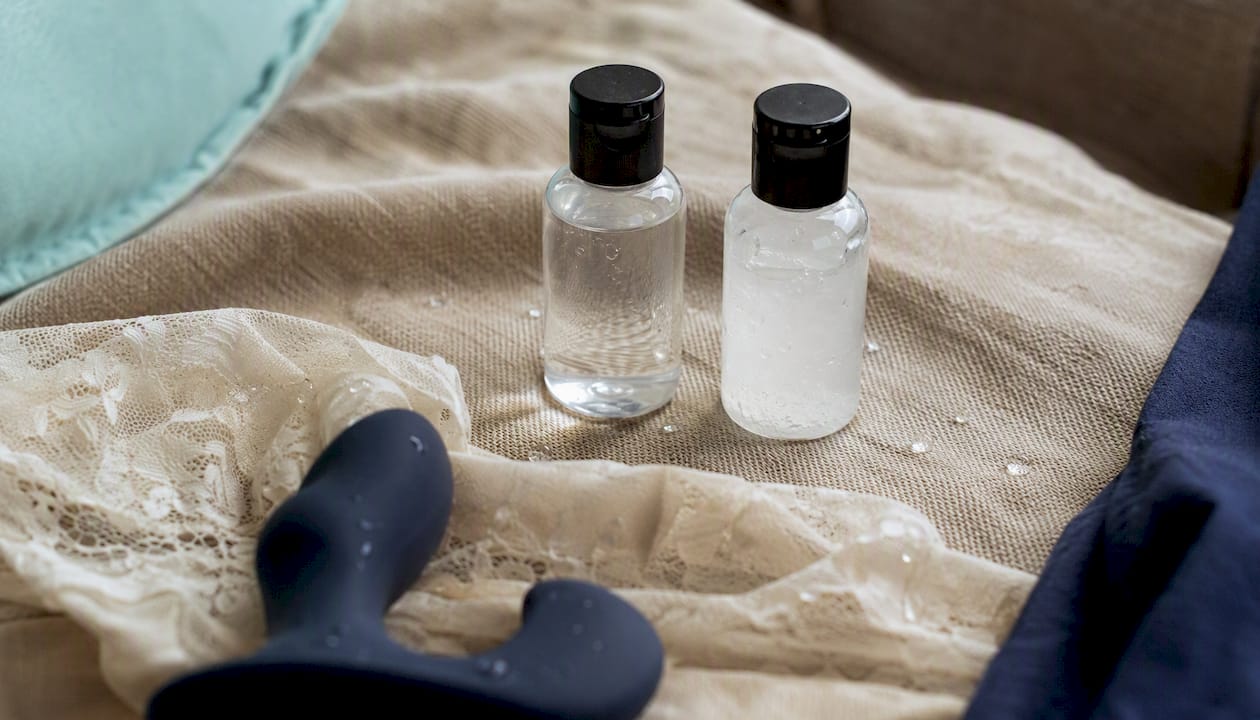 Water-based and silicone lubricants on fabric background