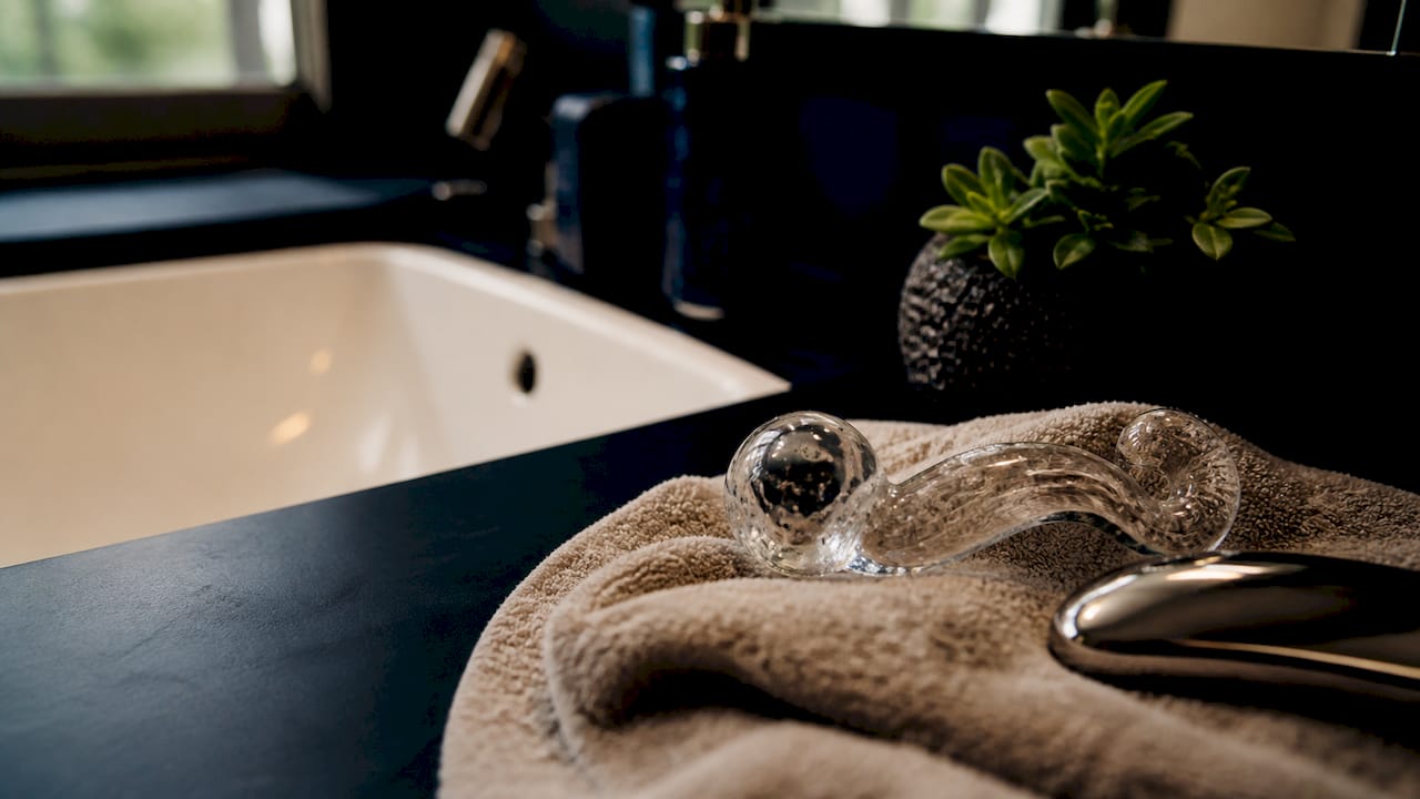 Close view of glass and steel toys on towel