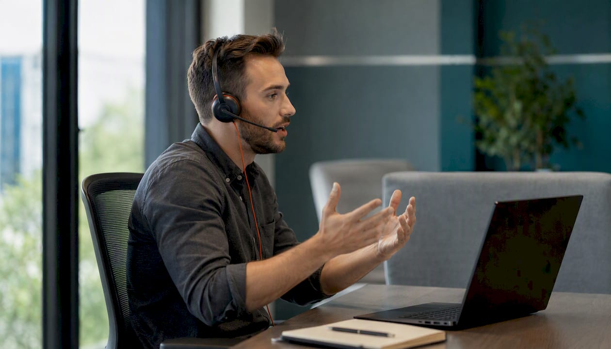 Sales rep practicing sales call with headset