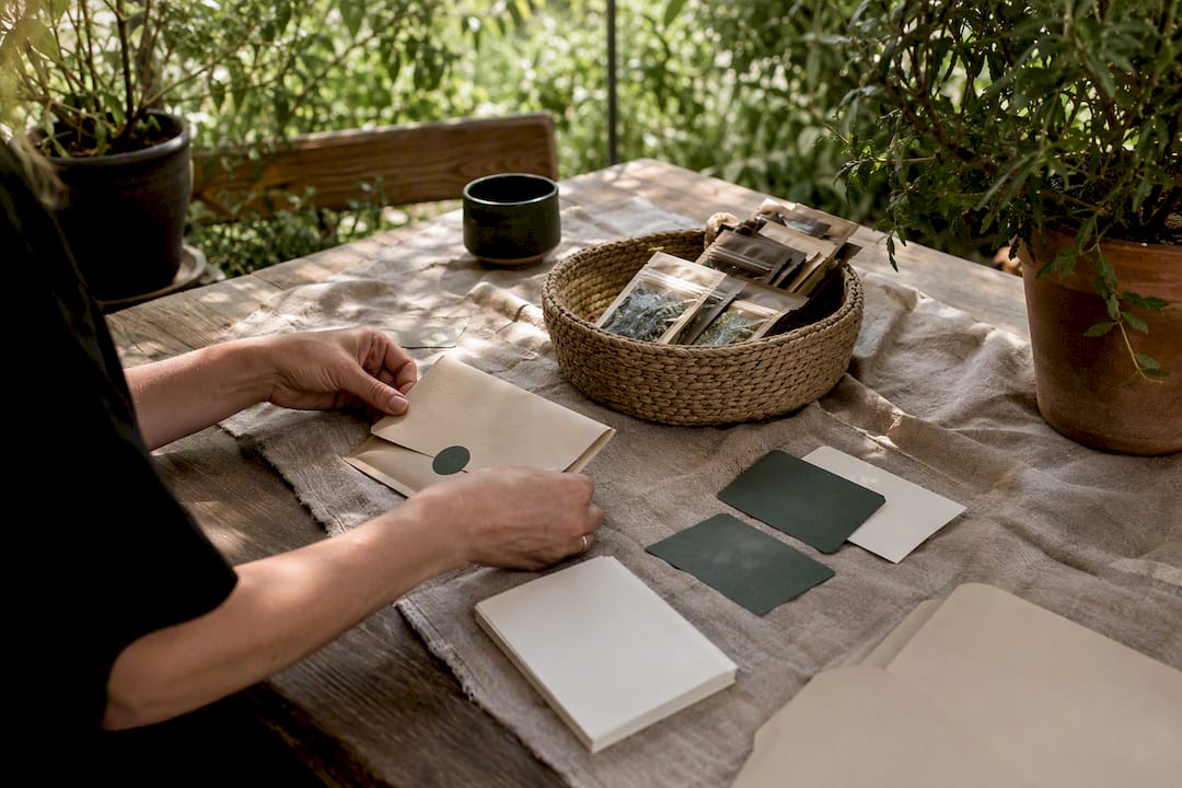 Hands preparing wellness membership materials