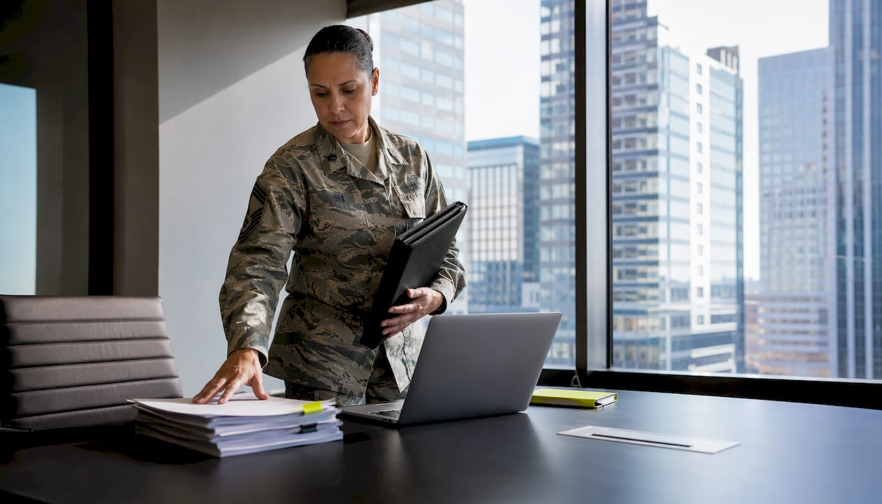 Service member reviewing life insurance documents