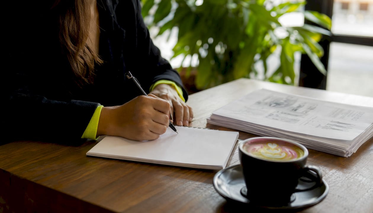 Underwriter hands checking medical records