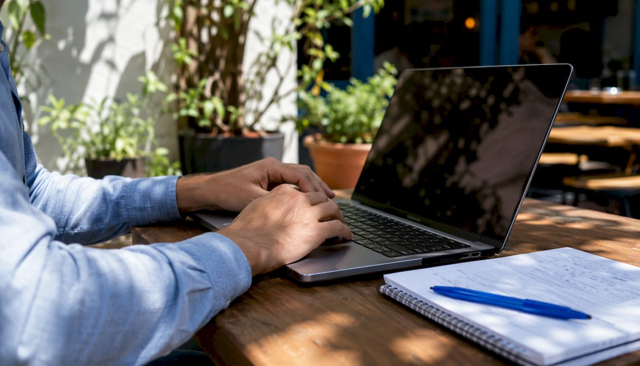 Researcher adjusting laptop settings for privacy
