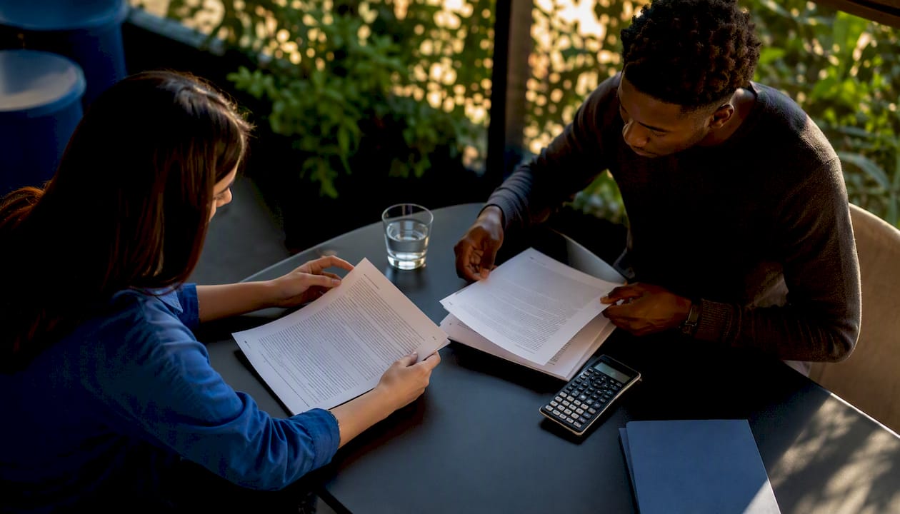 Hands organizing research protocol documents