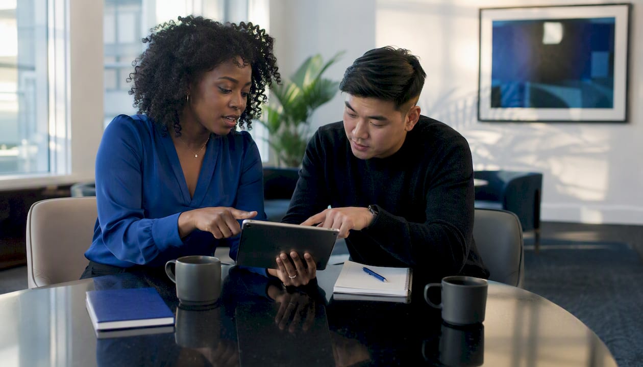 Two professionals discussing enterprise data quality