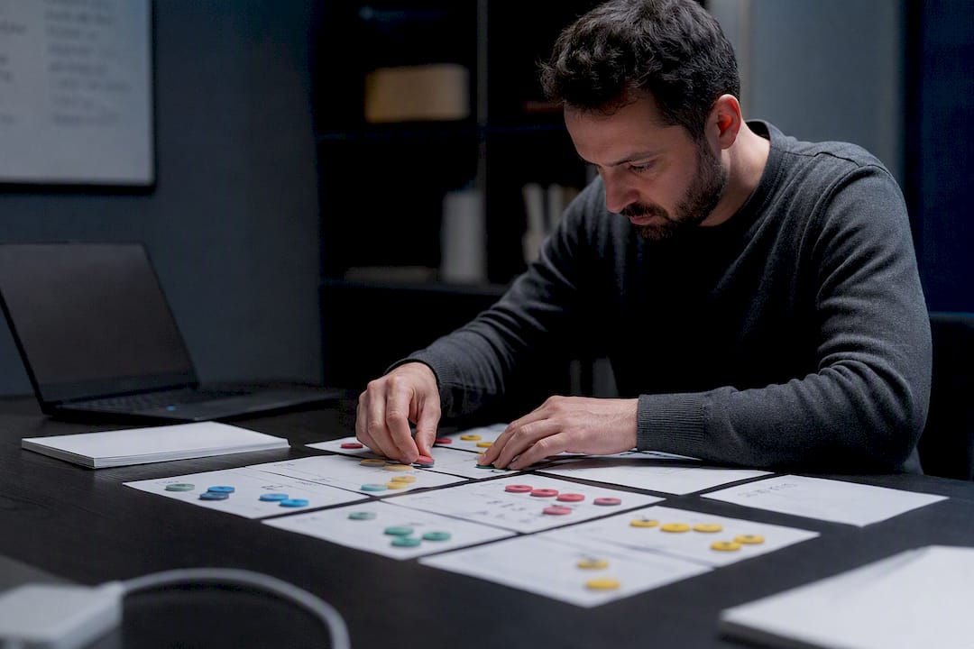 Hands arranging churn model data tokens