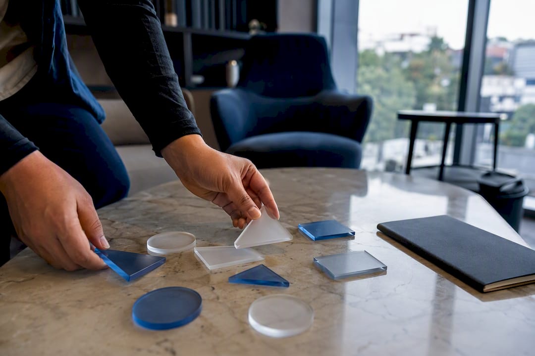 Hands arranging strategic analytics governance tokens