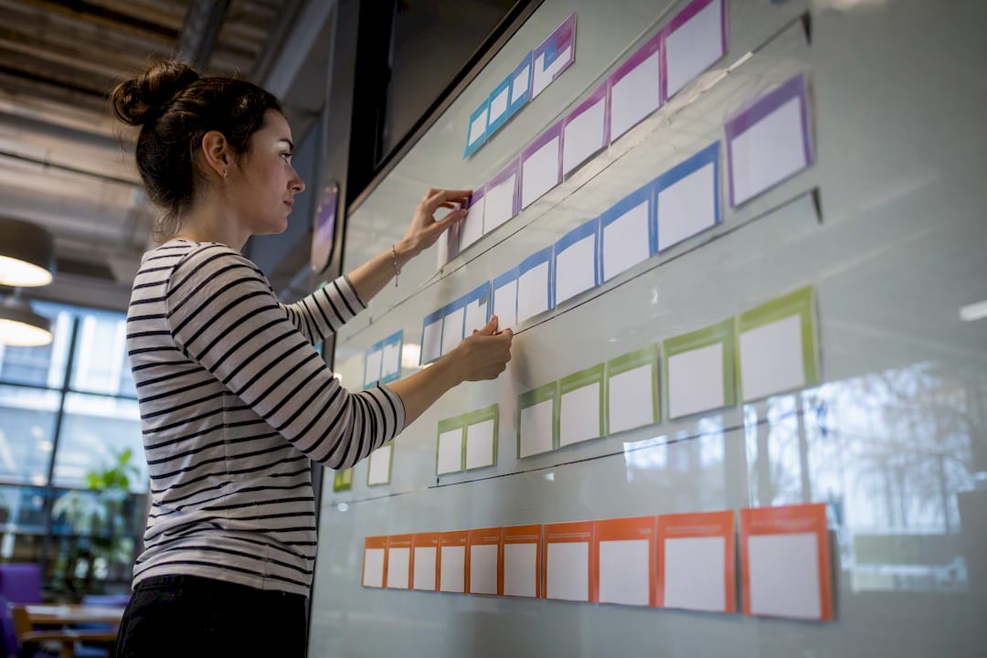 Hands arranging control cards on board