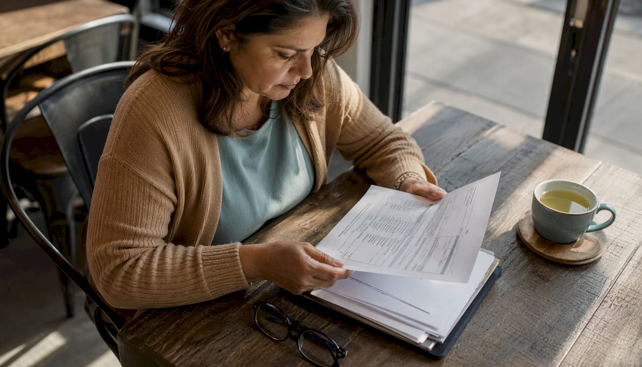 Businesswoman reviewing insurance certificate