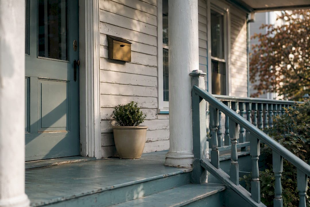 Historic home porch with weathered siding detail