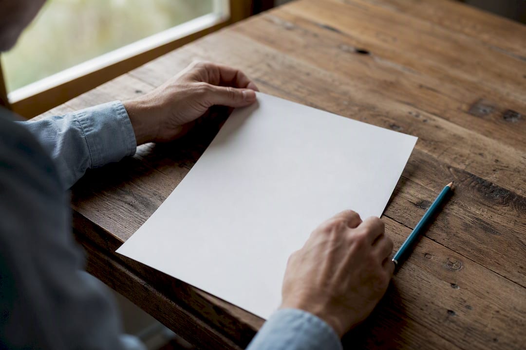 Hands checking insurance paperwork details