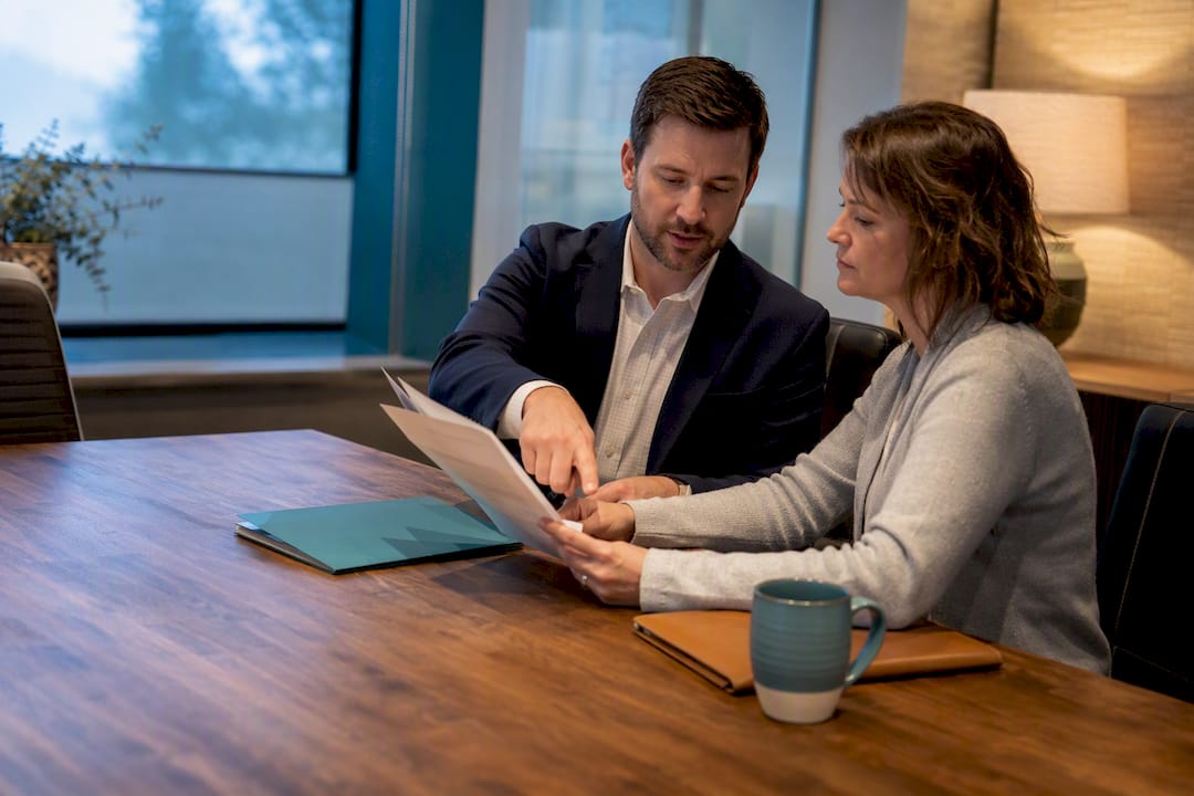 Business owners reviewing insurance endorsement documents