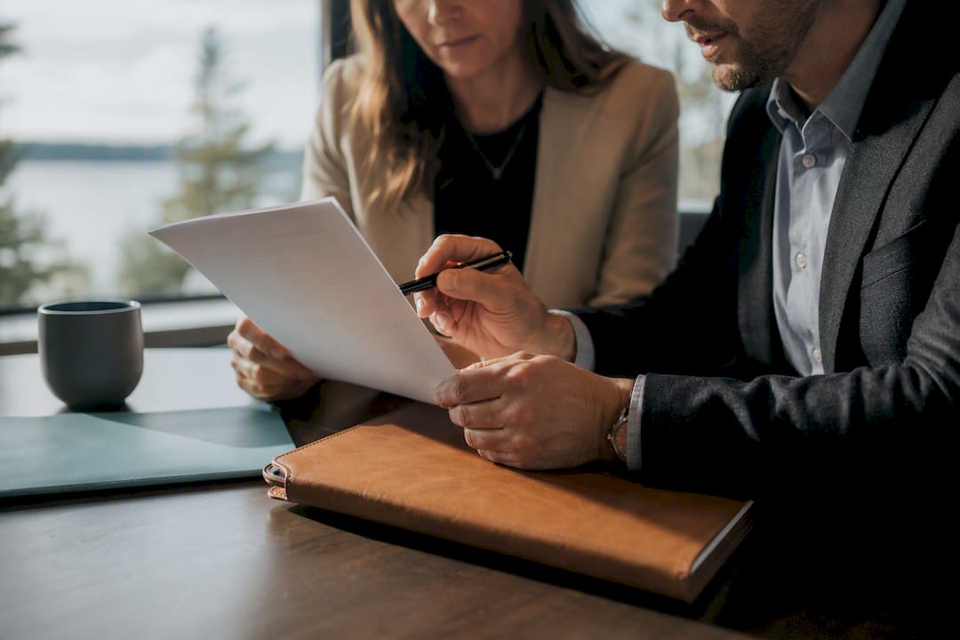 Consultant reviewing client deliverable with adviser