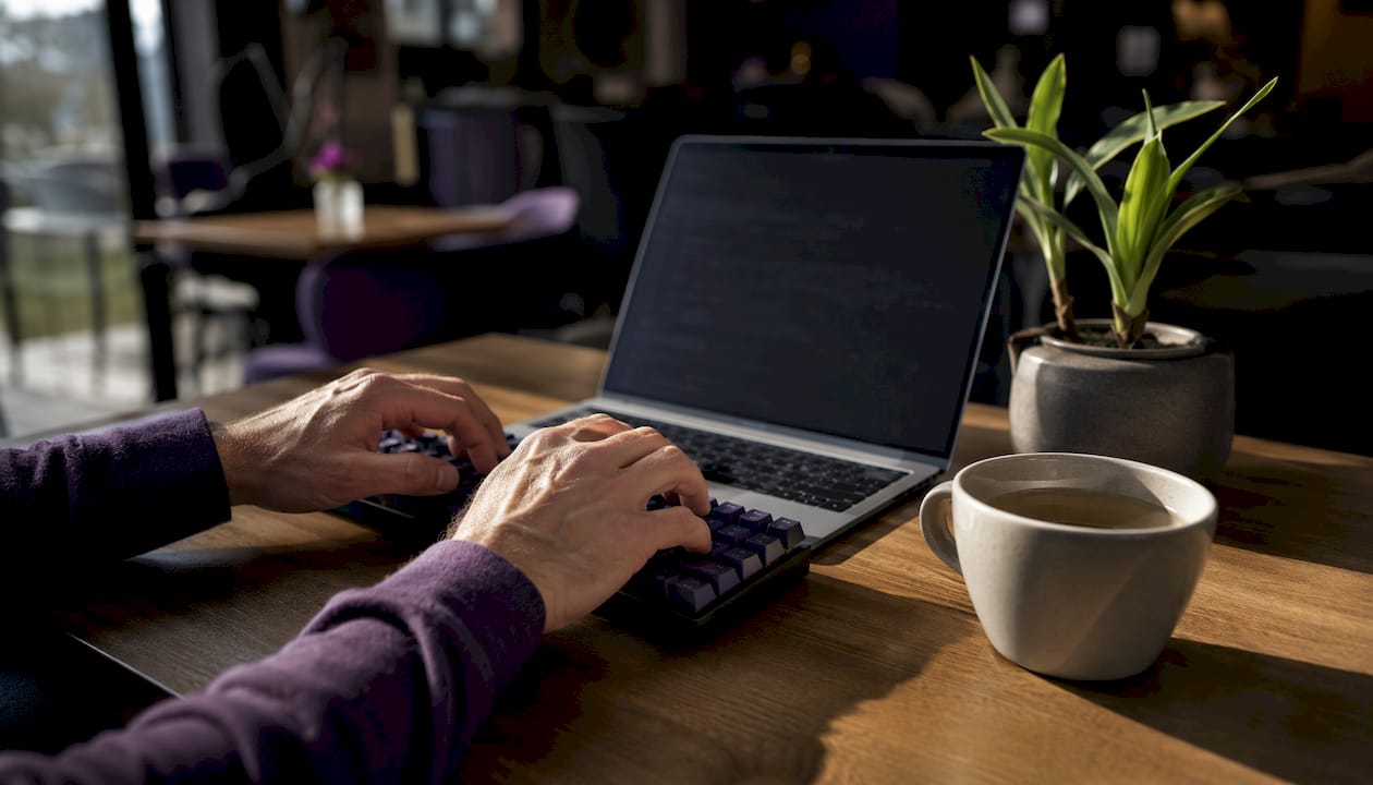 Hands typing server-side analytics code