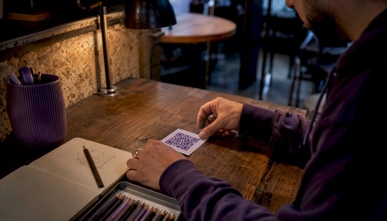 Designer adjusting branded QR code printout