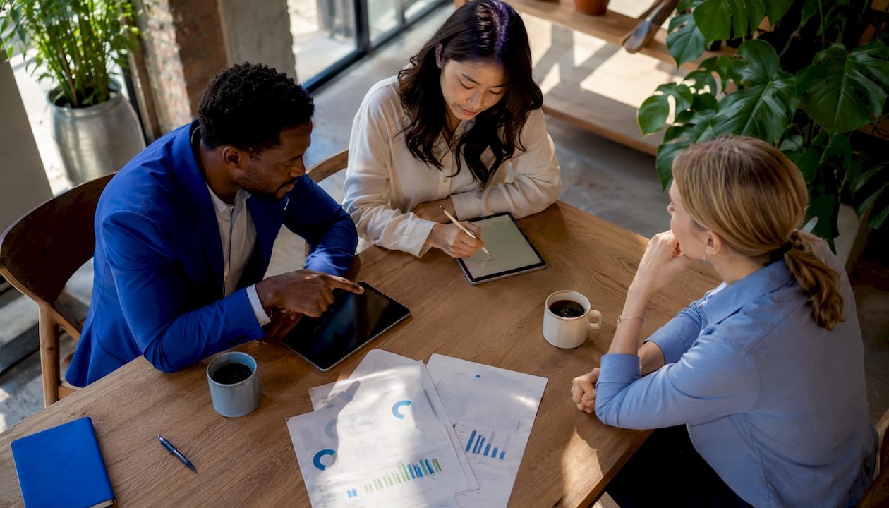 Managers discussing AI scheduling ROI in meeting