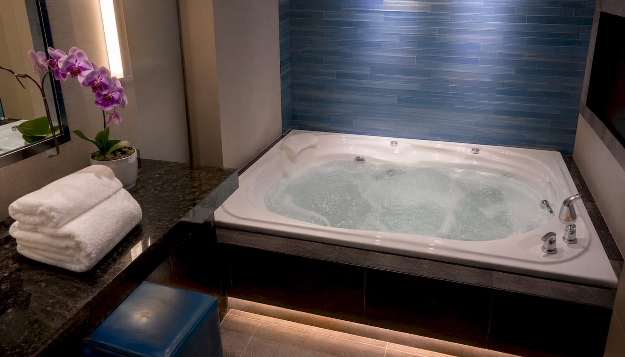 Jetted whirlpool tub in luxury hotel bathroom