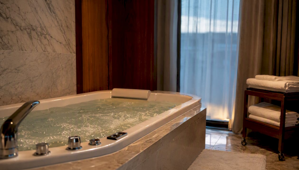 Built-in hotel suite bathroom jacuzzi bubbling