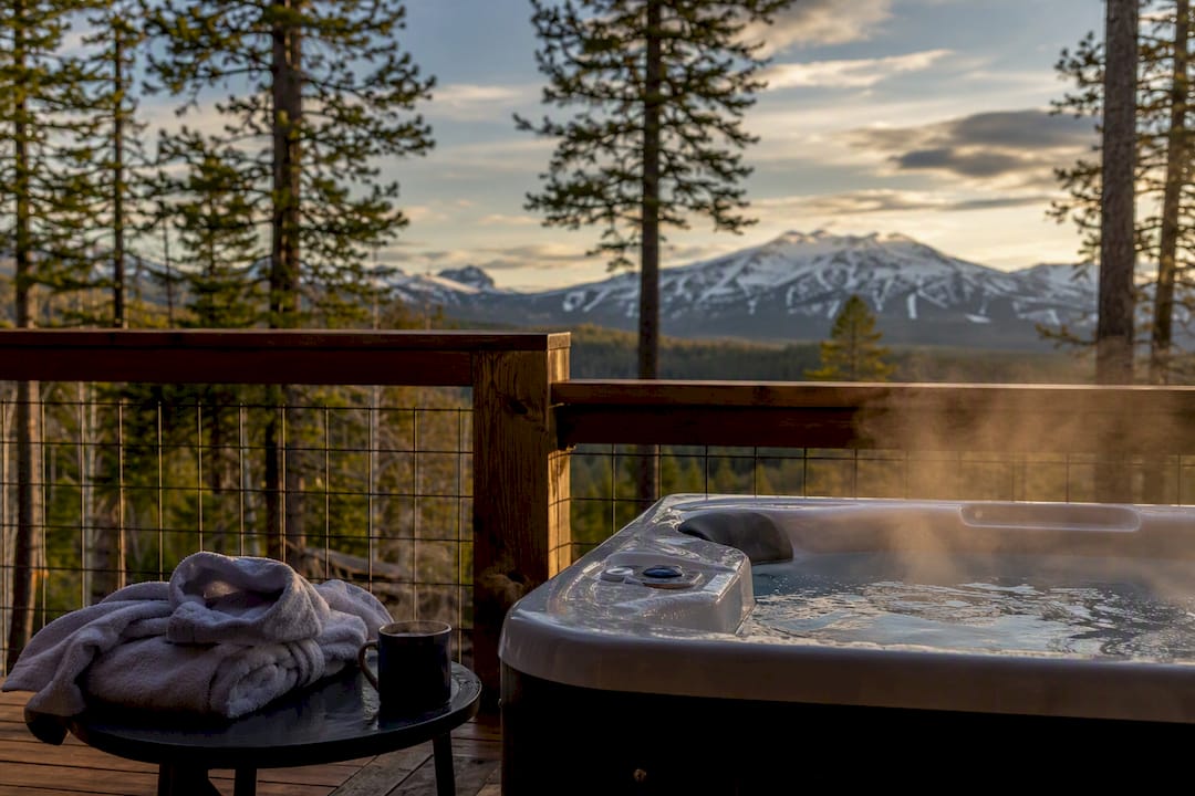 Outdoor private hot tub on mountain balcony