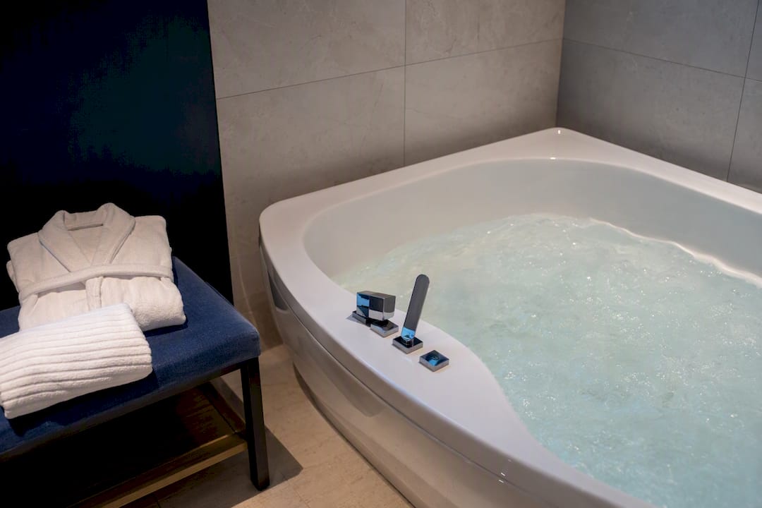 In-room jacuzzi tub ready for guest use