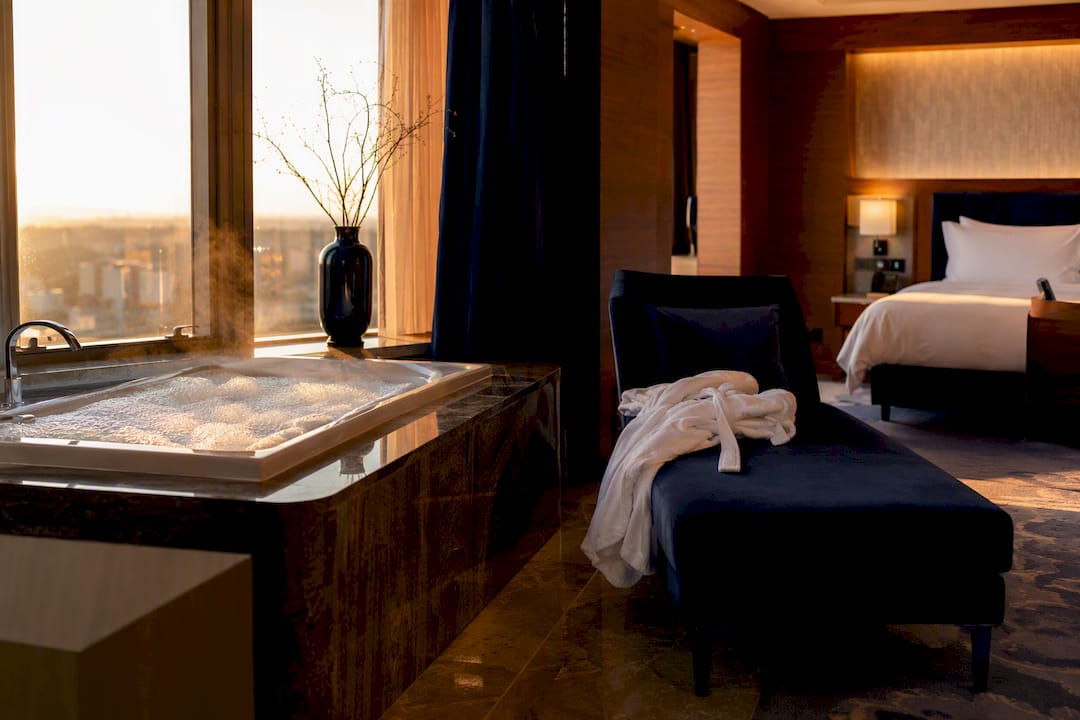 Standalone spa jacuzzi tub in hotel suite alcove