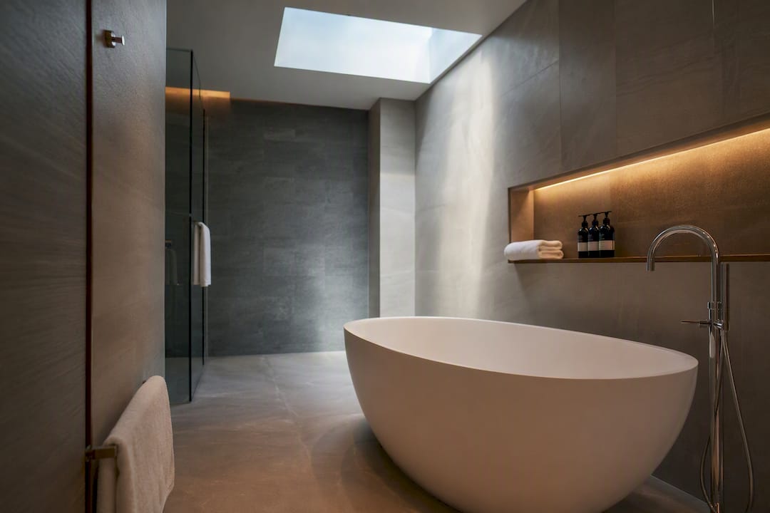 Hotel bathroom with soaking tub layout visible