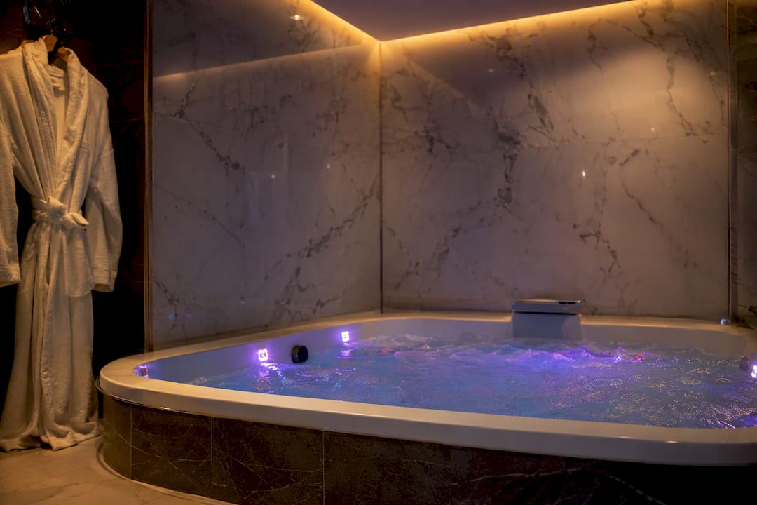 Private jacuzzi with glowing mood lights and bubbles
