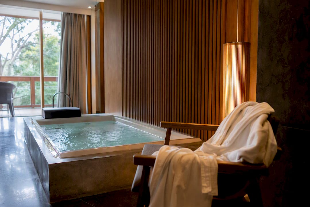 Boutique hotel suite corner jacuzzi tub