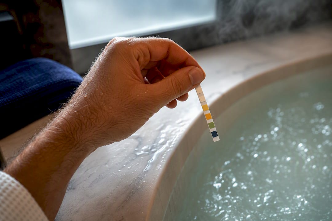 Guest checking hotel jacuzzi water