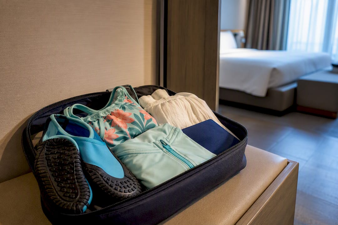 Children’s swimwear and water shoes packed
