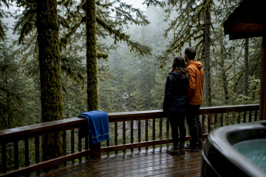 Couple viewing foggy Pacific Northwest forest
