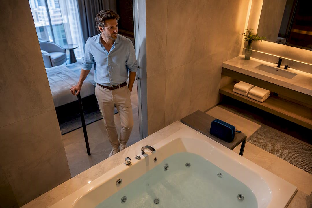 Traveler verifying a private hotel jacuzzi