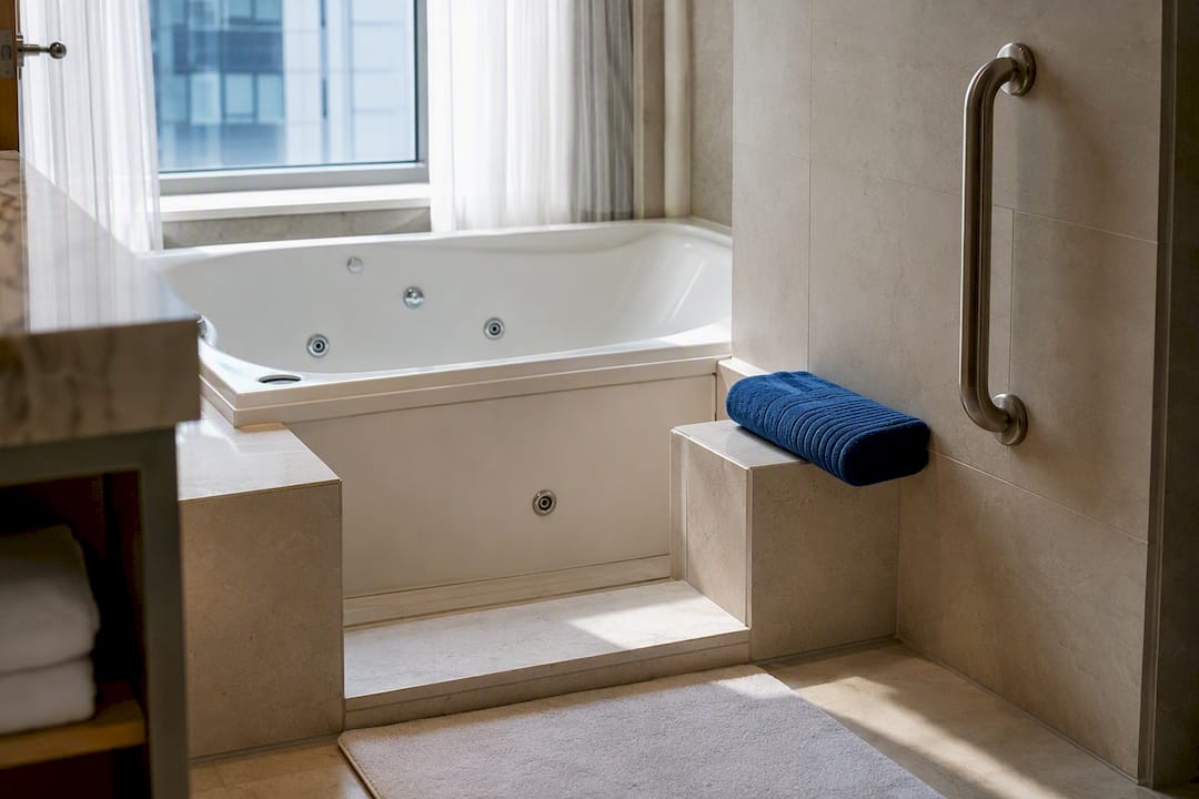Grab bar and low tub entry in hotel bathroom