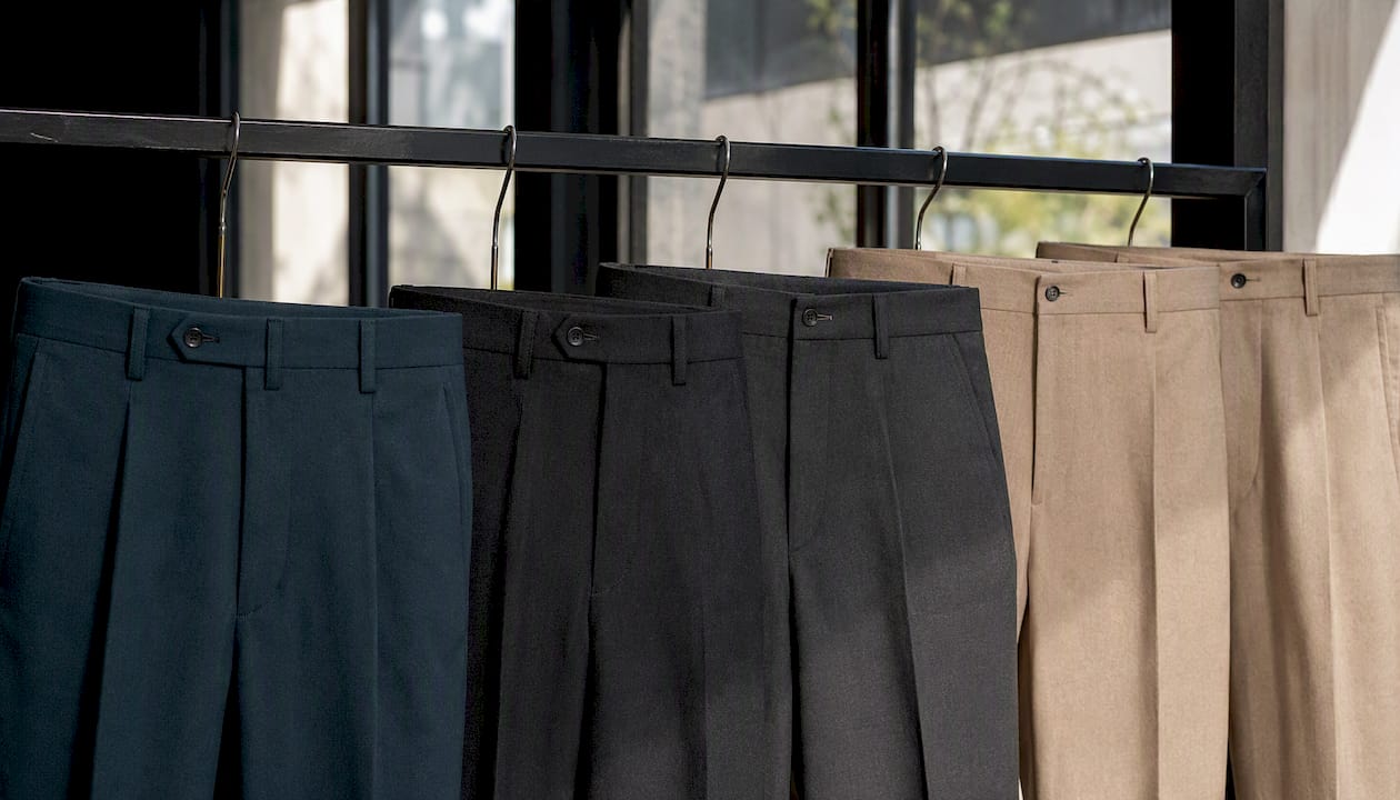 Close-up of waistbands showing trouser rise types