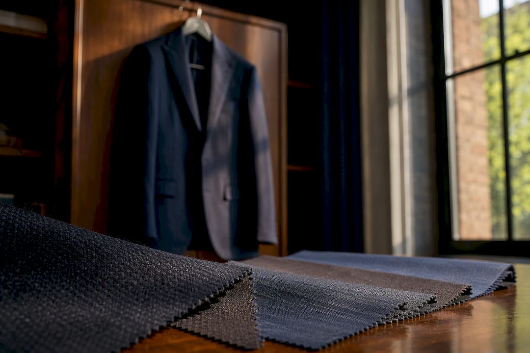 Suit fabrics and jacket showing fabric weight differences