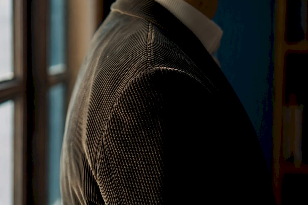 Close shoulder fit detail of corduroy jacket